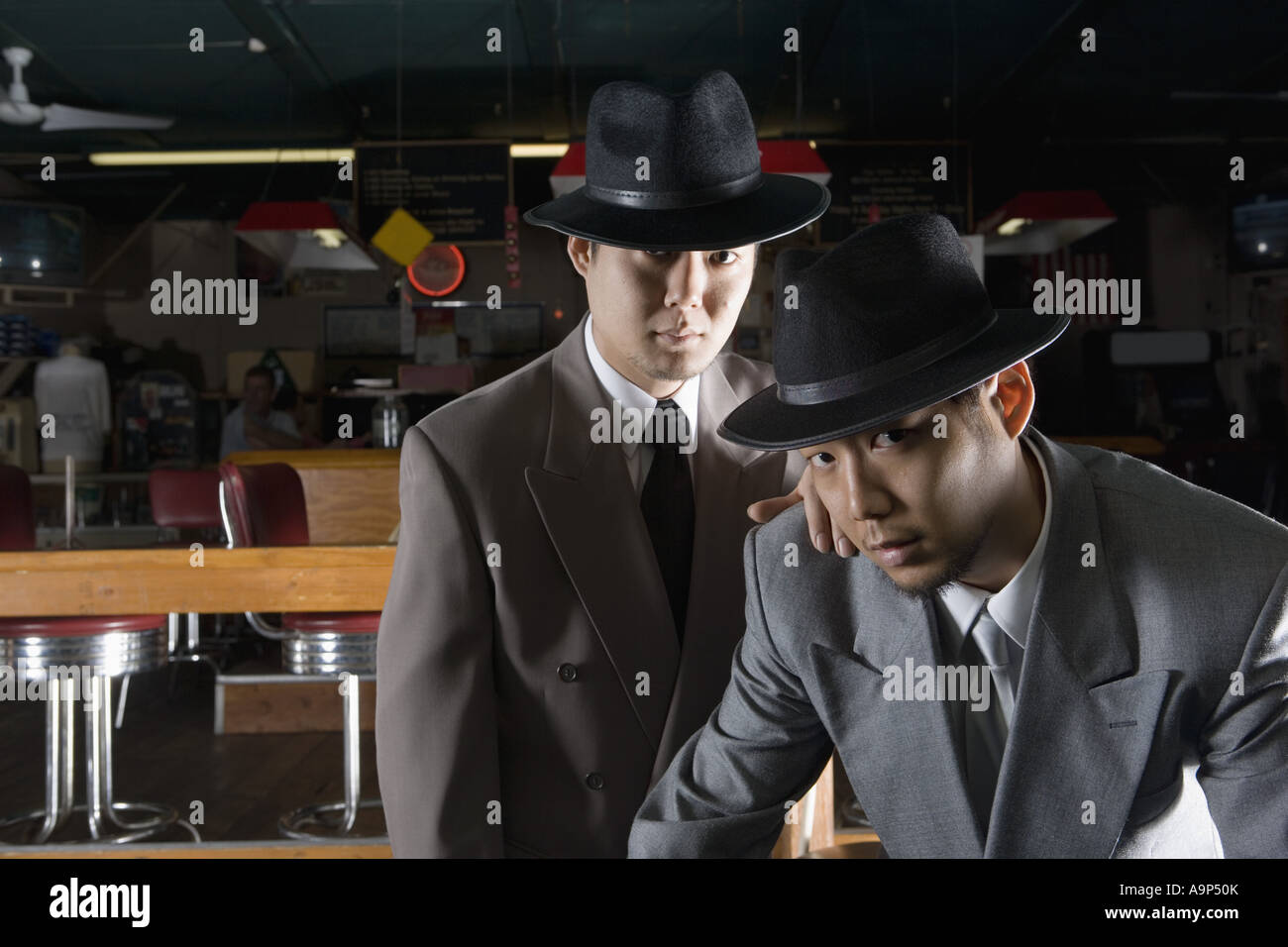 Portrait of two men in suits and hats Stock Photo - Alamy