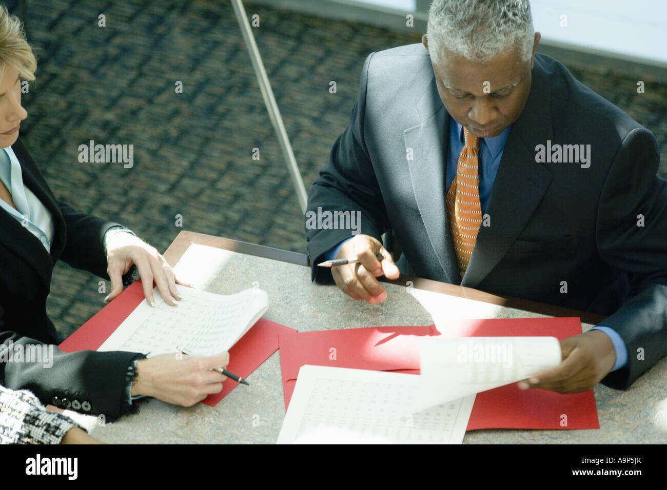 Chart Patterns Images Two colleagues reviewing chart hi-res stock photography and images - Alamy