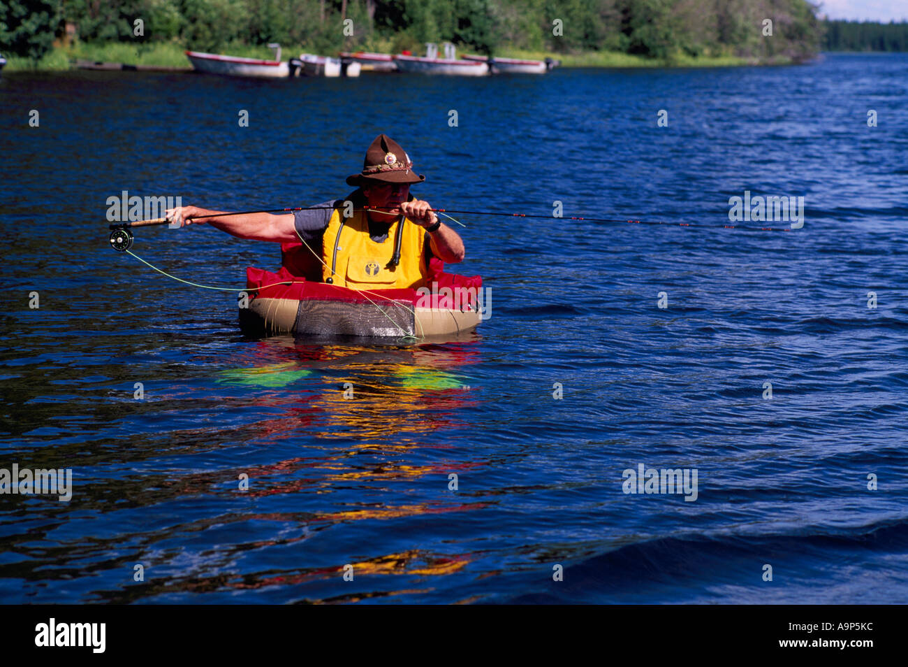 https://c8.alamy.com/comp/A9P5KC/fly-fisherman-in-a-belly-boat-fishing-for-trout-in-hi-hium-lake-in-A9P5KC.jpg