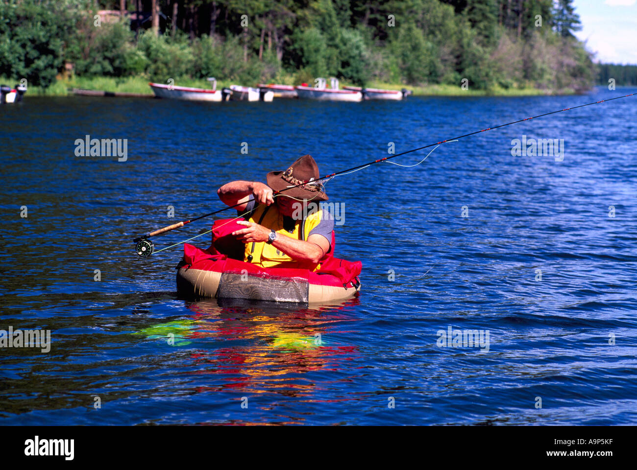 Fly Fisherman in a Belly Boat fishing for Trout in Hi Hium Lake in