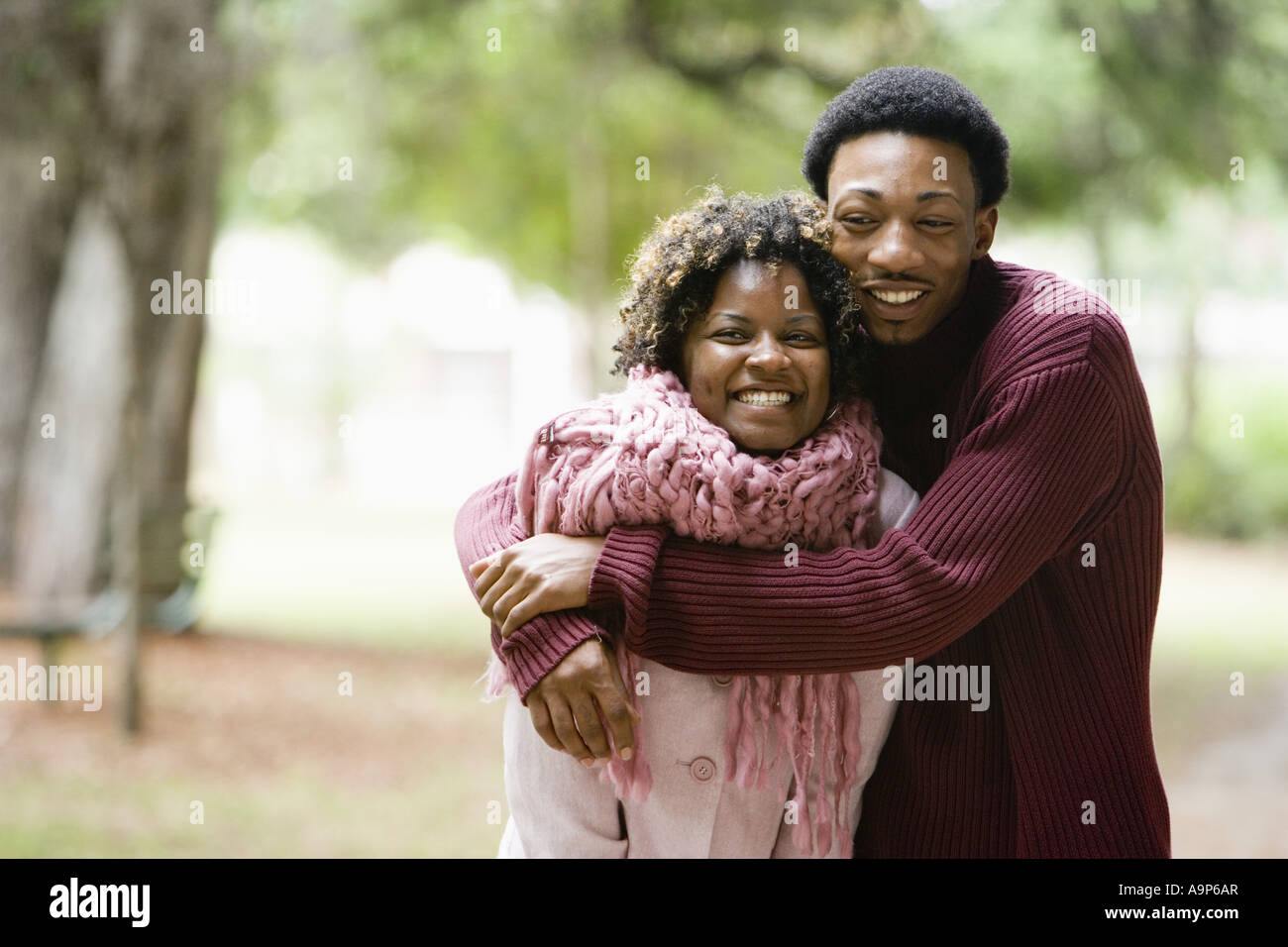 Young man embracing a young woman Stock Photo