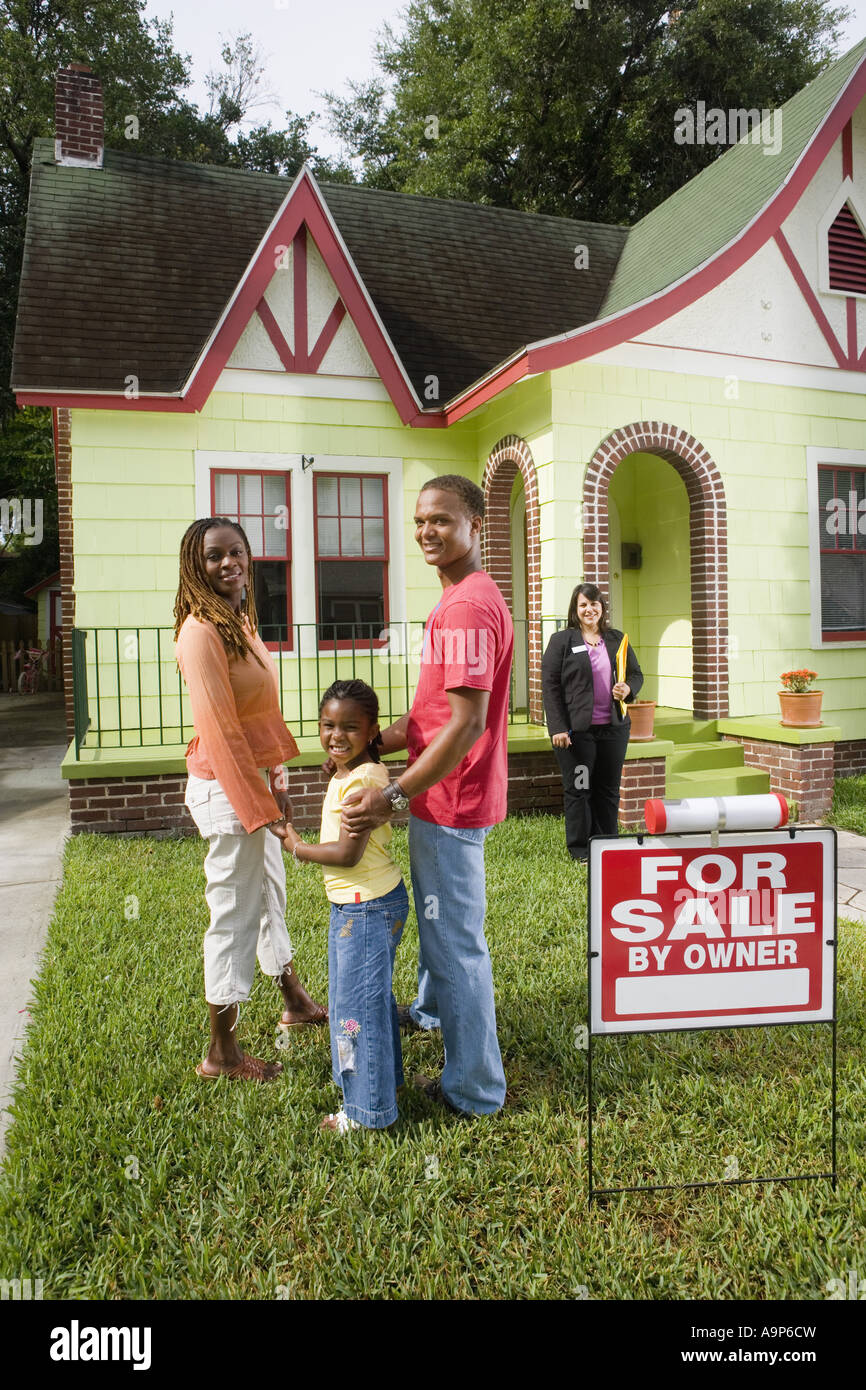 Real estate broker showing house to buyers Stock Photo Alamy