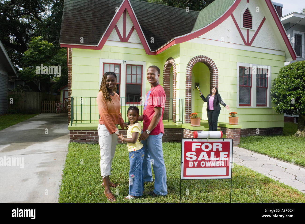 Real estate broker showing house to buyers Stock Photo Alamy