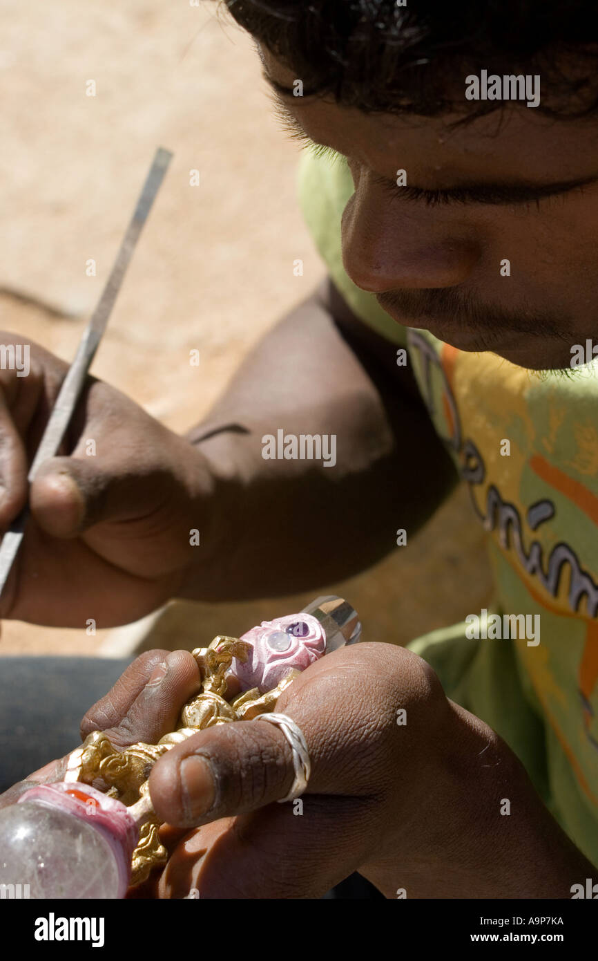 Indian man carving crystal wand. India Stock Photo