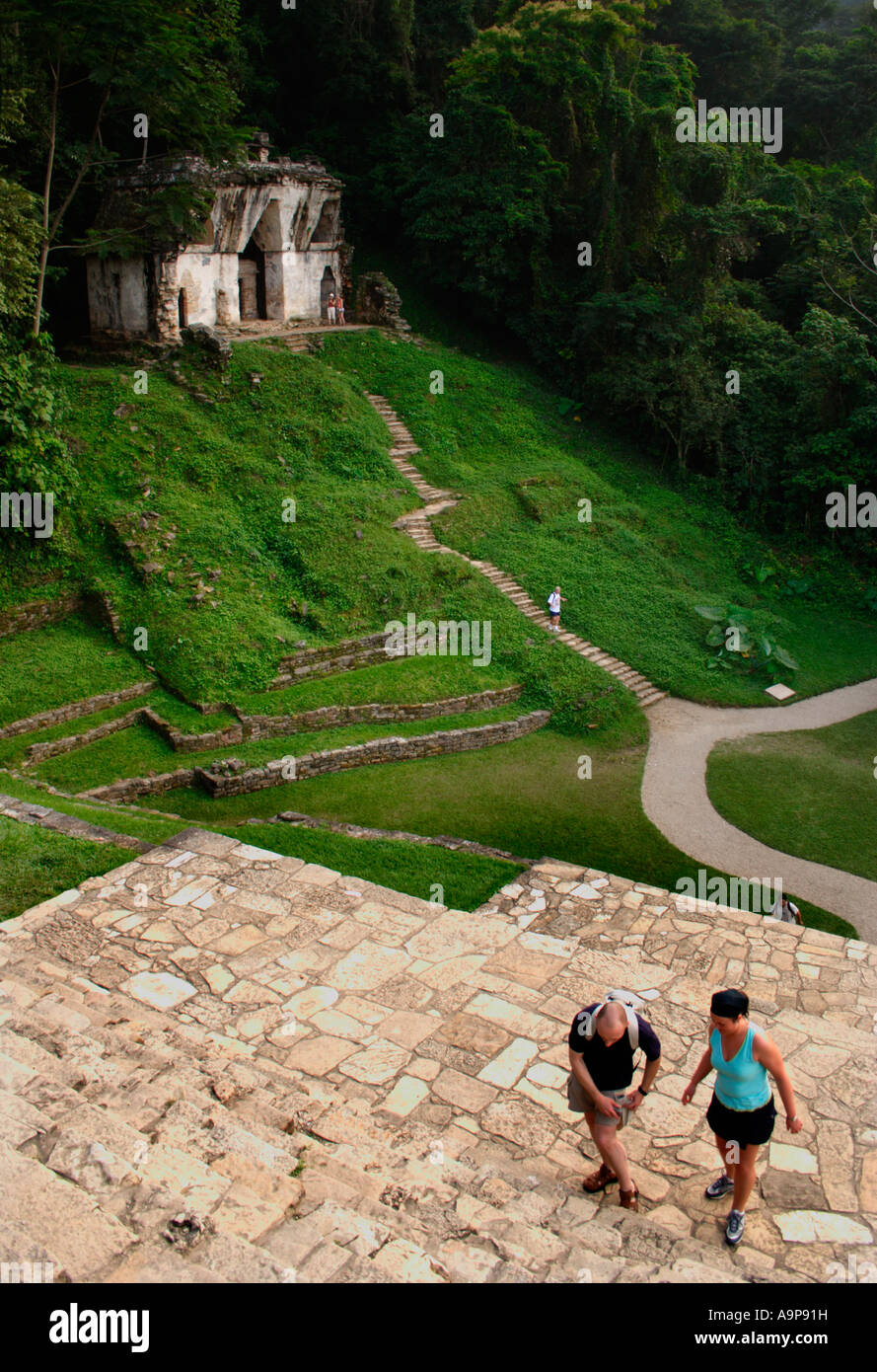 tourists climb steps of the Temple of the Cross witha view of the Temple of the Foliated Cross in the background. Stock Photo