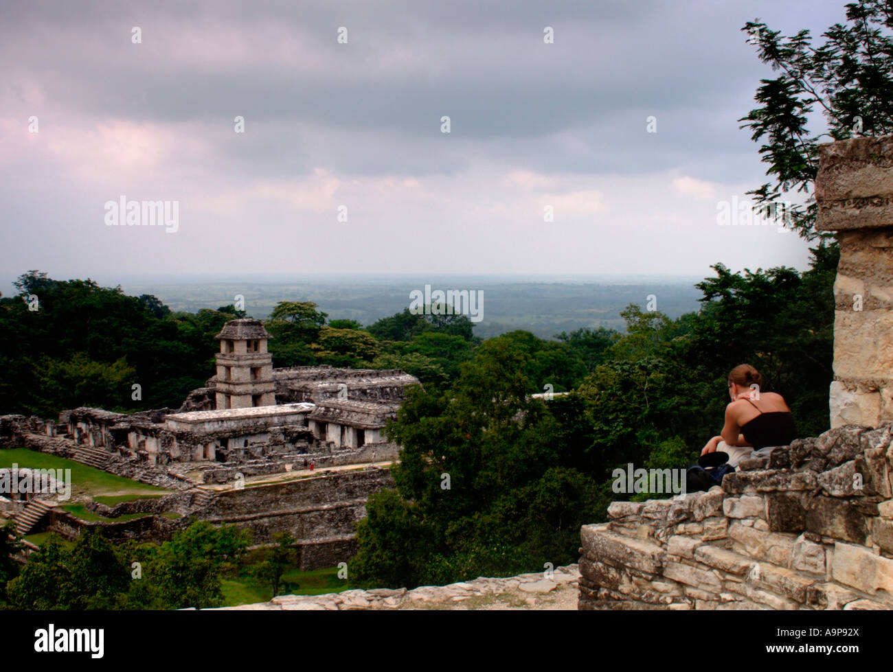 Tourist views the Palace at Palenque a Mayan archaeological ruinsite in Chiapas, Mexico Stock Photo