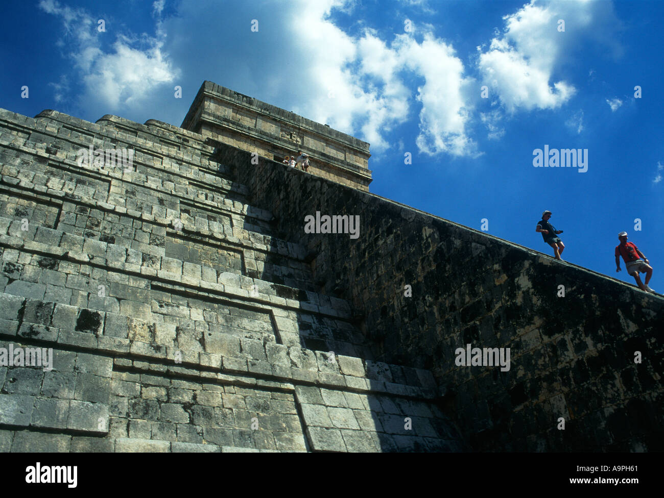 Mexico Quintana Roo Chichen Itza El Castillo people decending the stairs of the pyramid Stock Photo