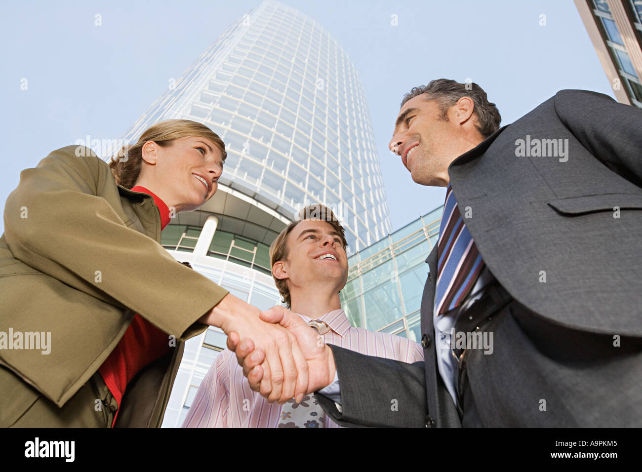Businesspeople shaking hands Stock Photo
