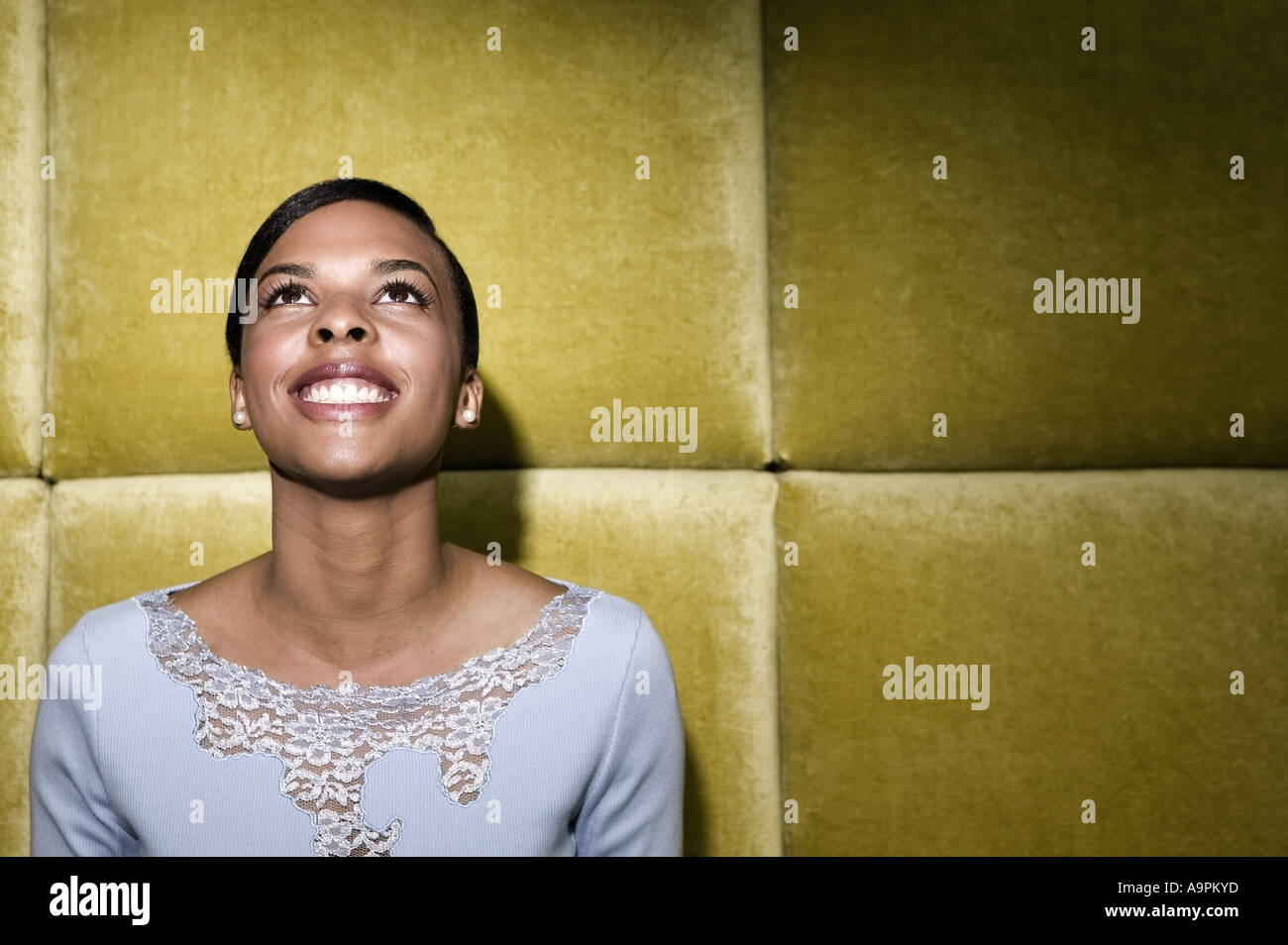 Black woman looking up hi-res stock photography and images - Alamy