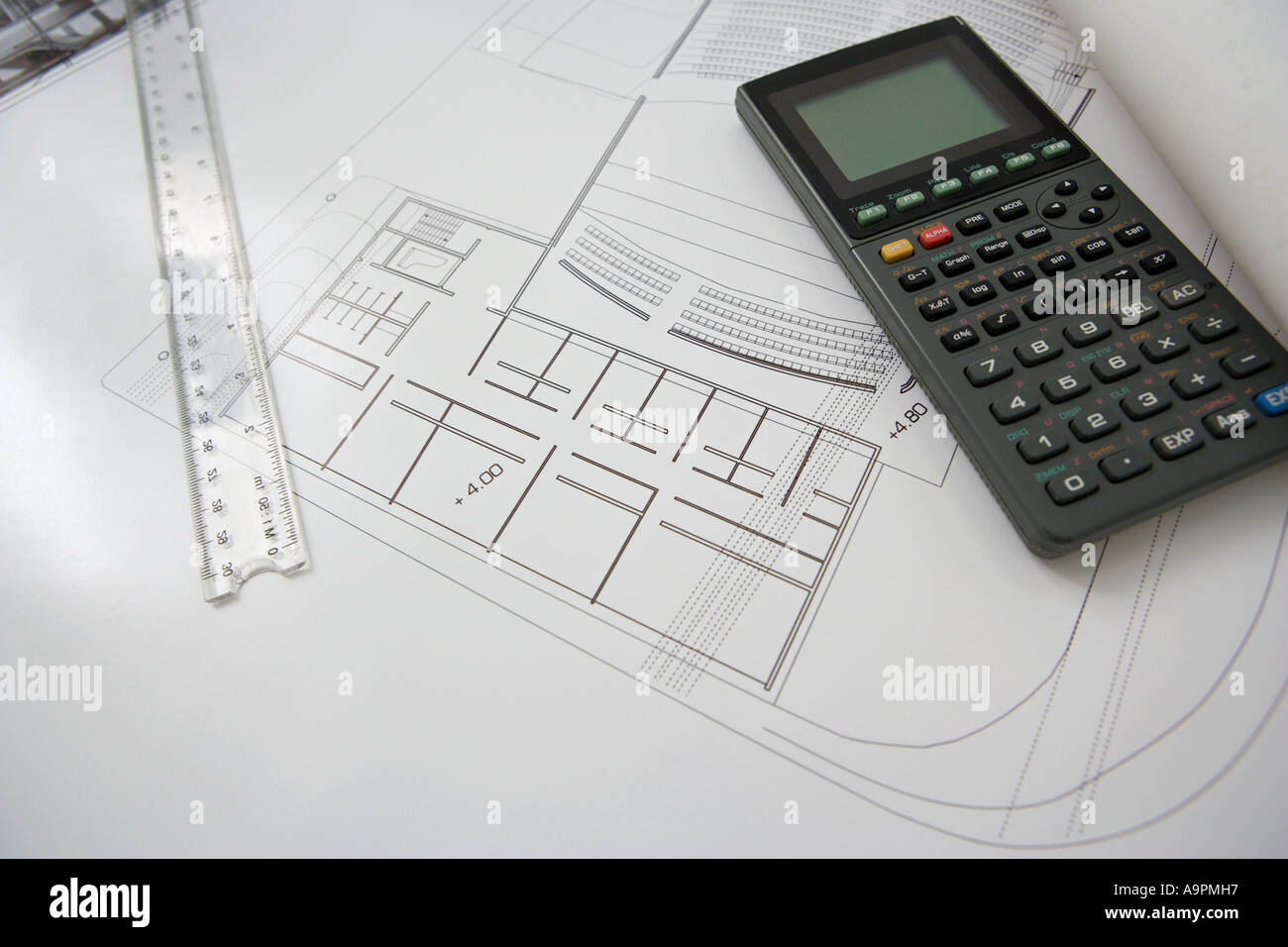Calculator and architectural plans Stock Photo - Alamy