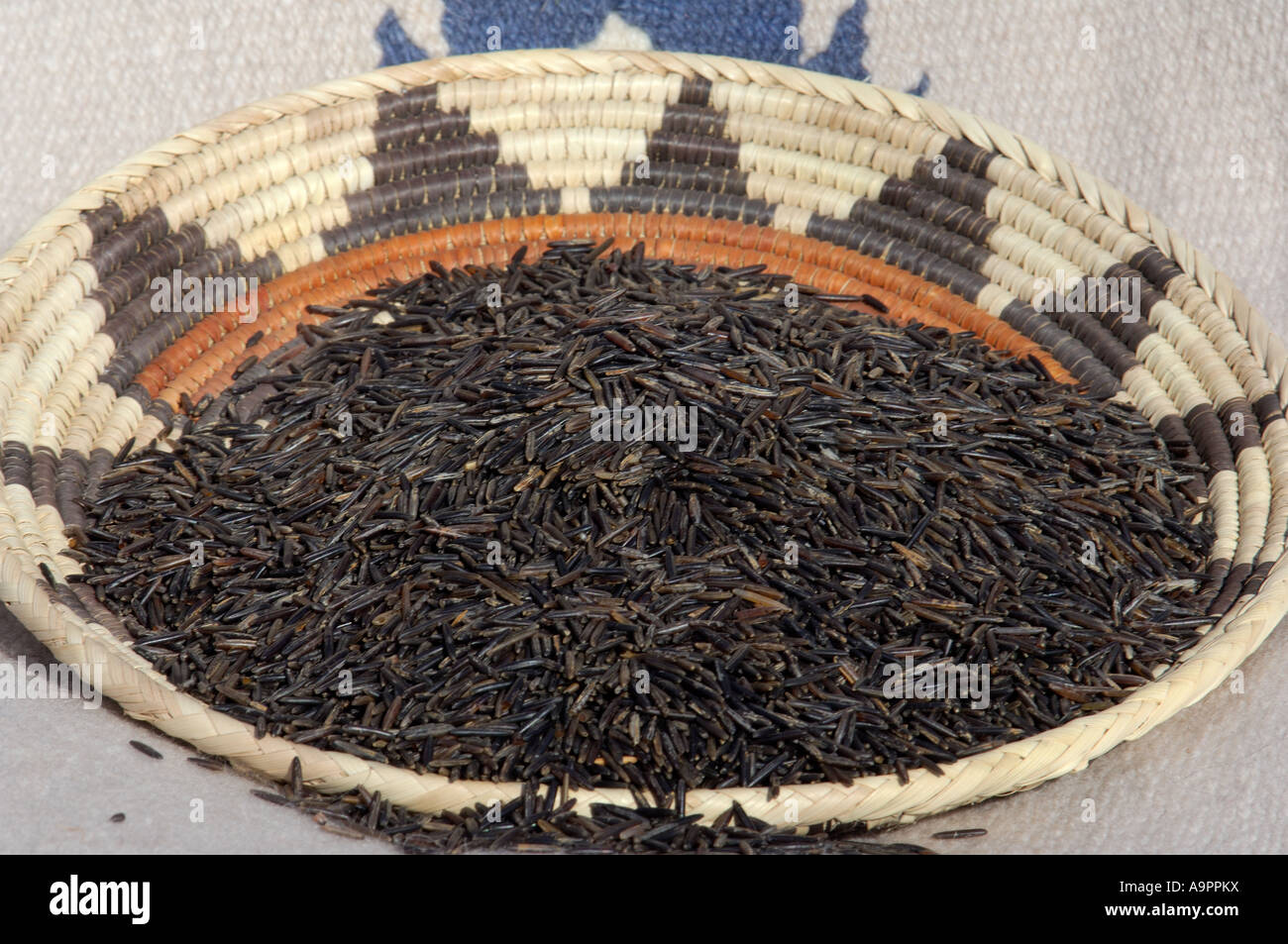 Wild rice from the Great Lakes area in a basket. Digital photograph Stock Photo