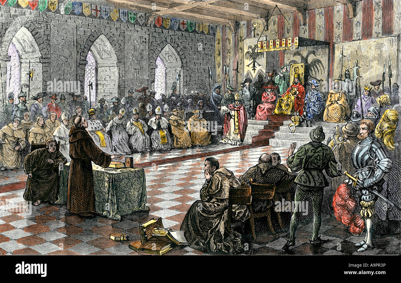 Martin Luther before Holy Roman Emperor Charles V at the Diet of Worms 1521. Hand-colored woodcut Stock Photo