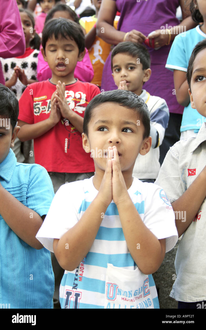 A young boy praying Stock Photo - Alamy