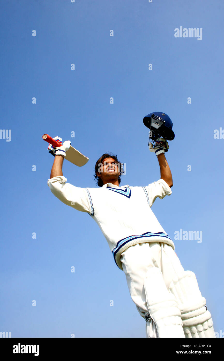 Batsman raising his bat Stock Photo