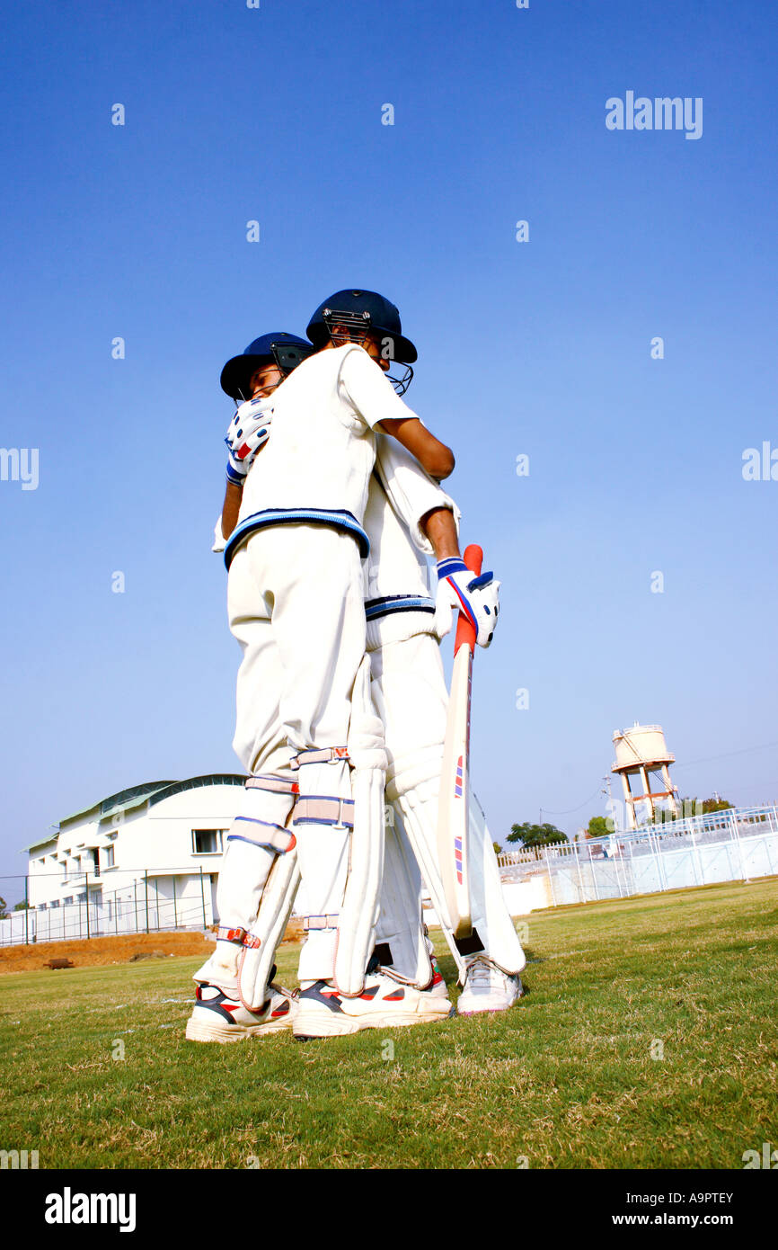 Batsman hugging eachother Stock Photo