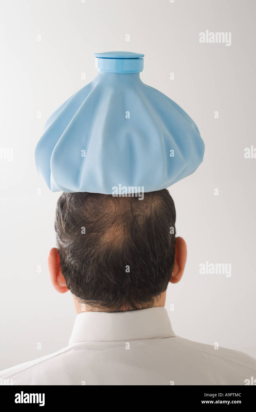 Man with ice pack on his head Stock Photo Alamy