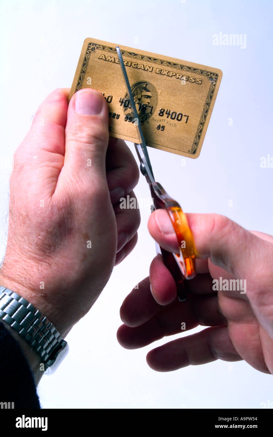 Cutting up Gold American Express credit card Stock Photo