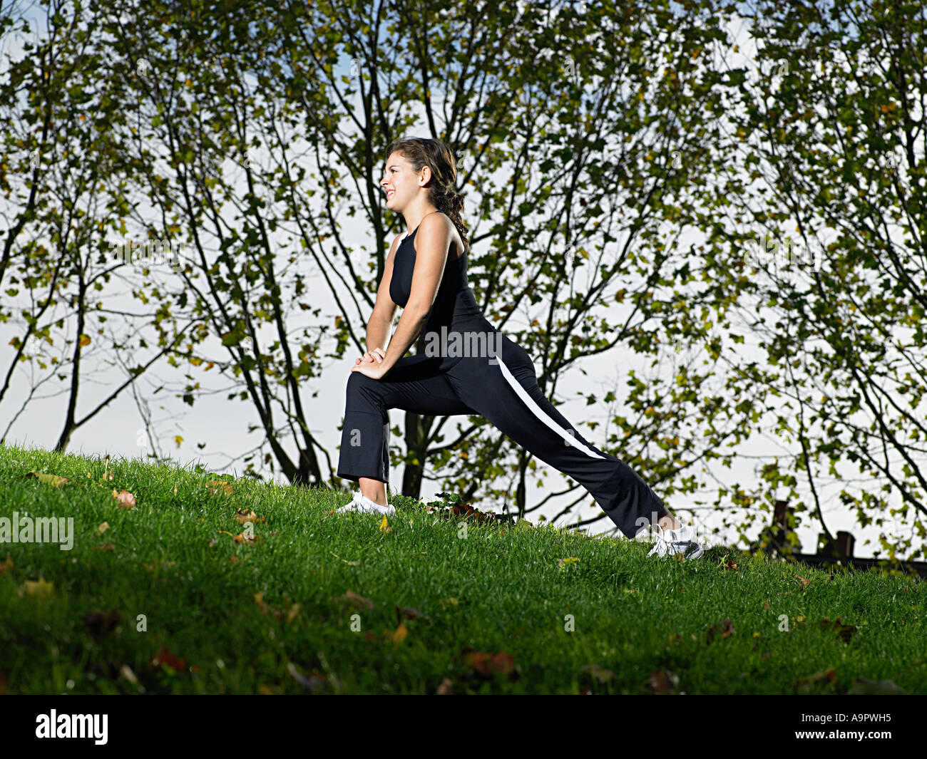 Jogger stretching Stock Photo