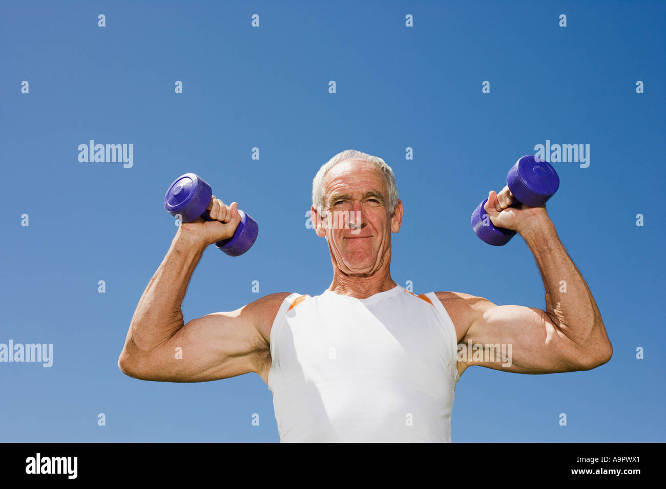 Senior adult man lifting dumbells Stock Photo Alamy