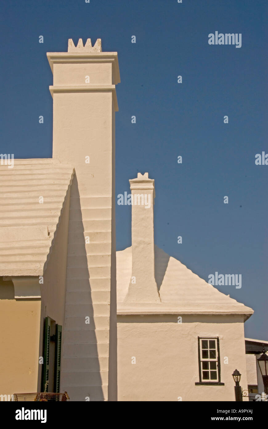 Bermuda white washed ribbed roof  chimneys Bermudan national symbol iconic image st george town Stock Photo