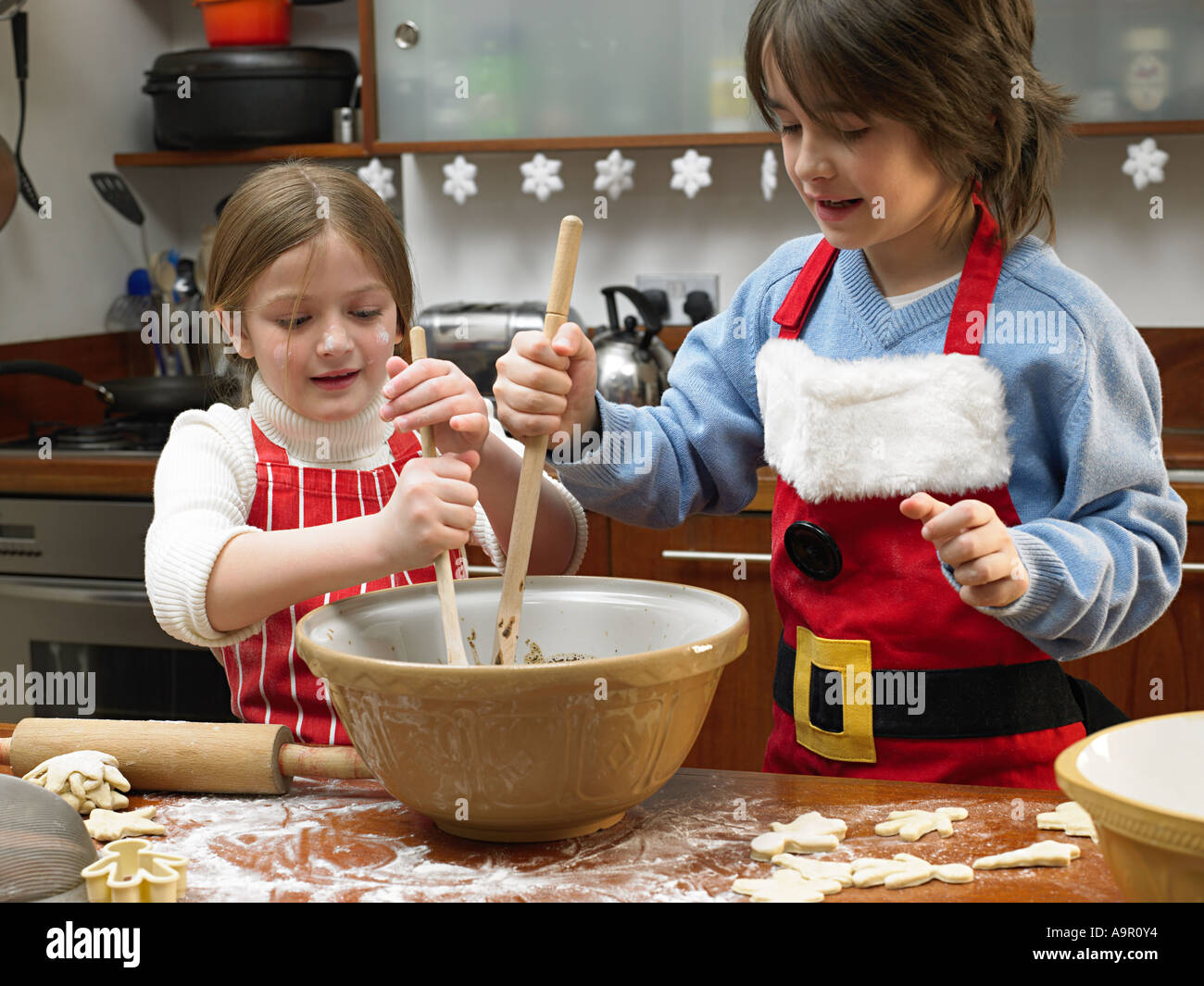 Kids making cookies Stock Photo - Alamy