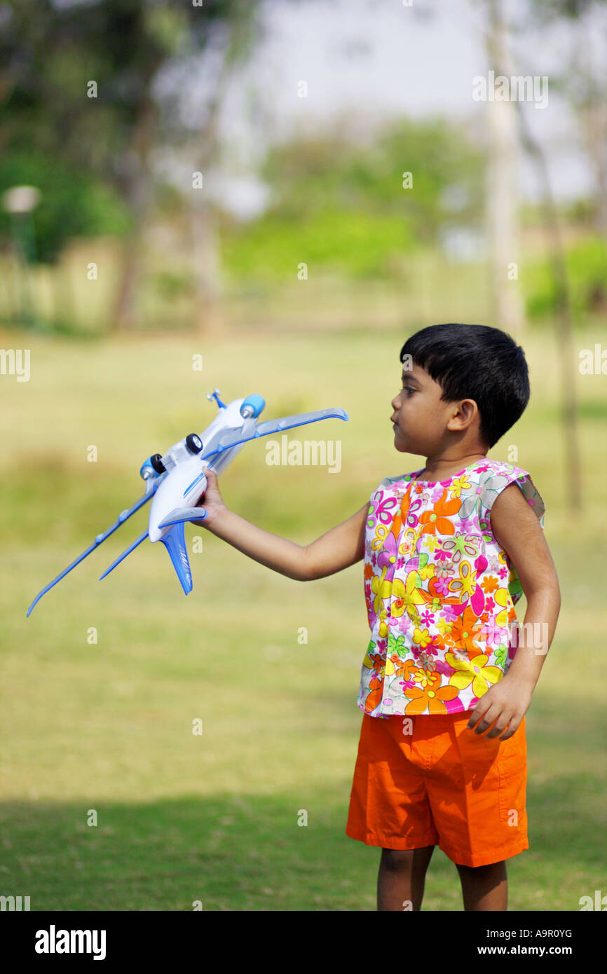 Young boy playing with a toy airplane Stock Photo - Alamy
