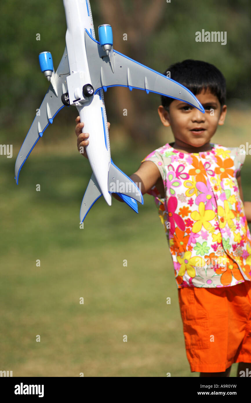 A young boy with a toy airplane Stock Photo - Alamy