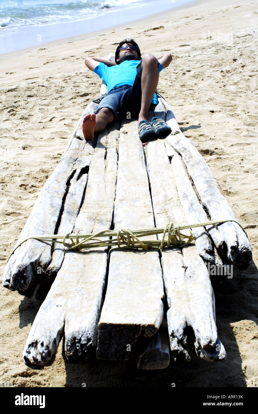 A man relaxing at a beach Stock Photo - Alamy