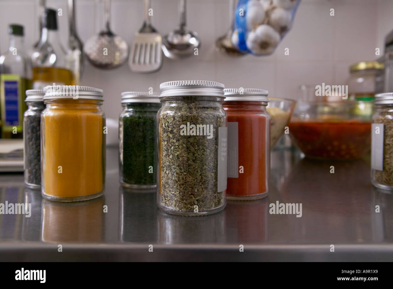 Jars filled with herbs and spices in kitchen Stock Photo Alamy