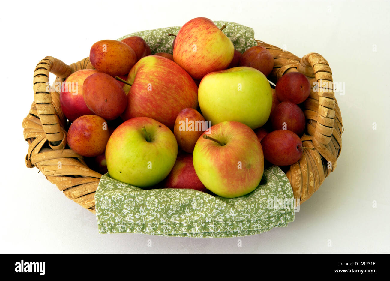 Basket of fruit apples and plums on display at Ludlow Food Festival Shropshire England UK Stock Photo