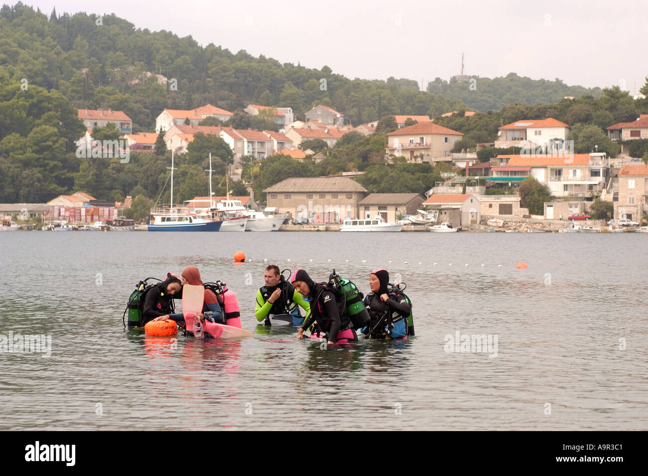Group of people learning to scuba dive in Croatian island of Korcula