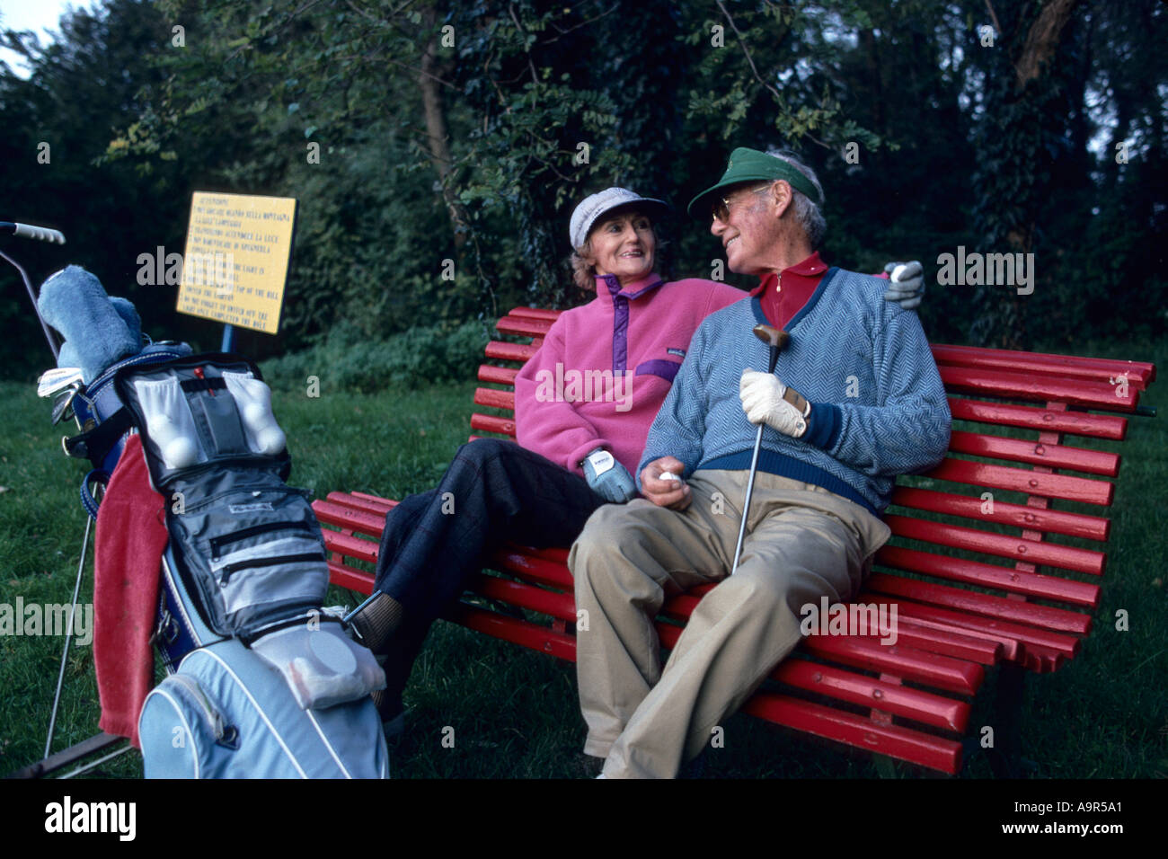 Lido of Venice, Italy. Couple in their seventies playing golf at the Alberoni Golf Course Stock Photo