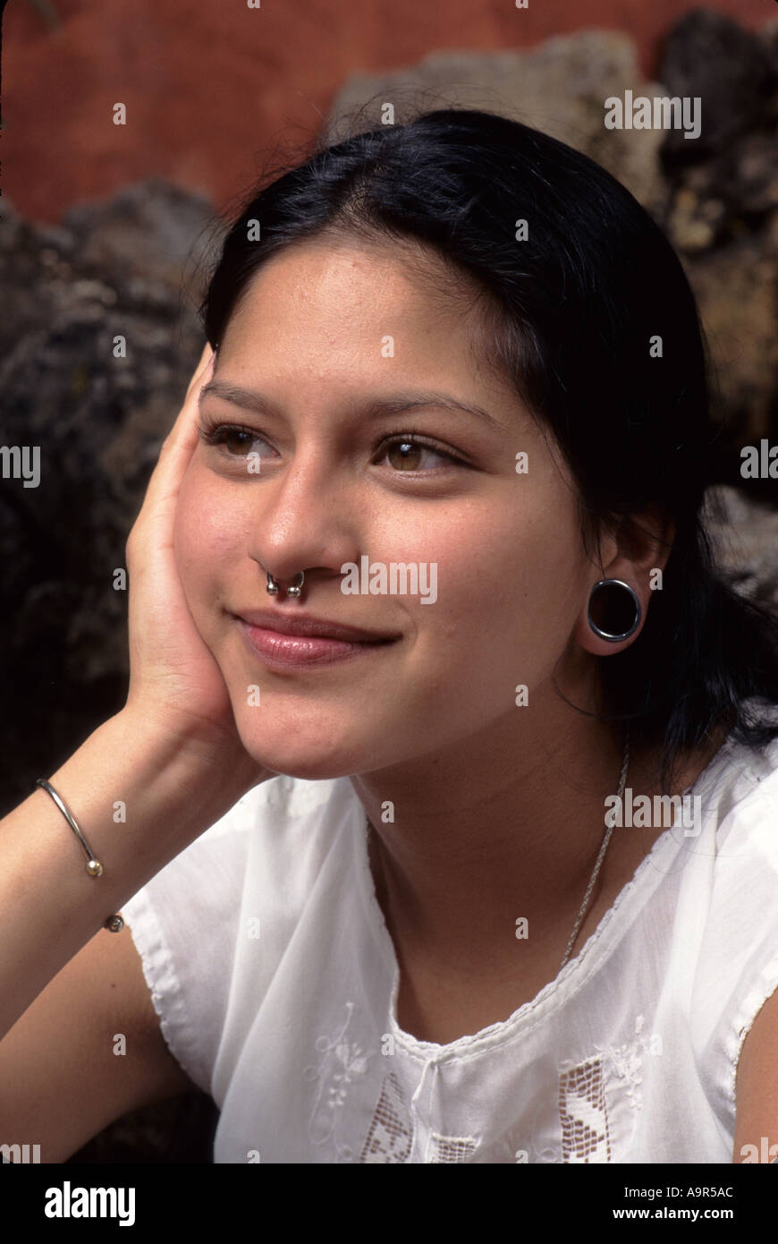 Berkeley, California. Young woman of mexican indian ethnicity with nose piercing and ear plug Stock Photo