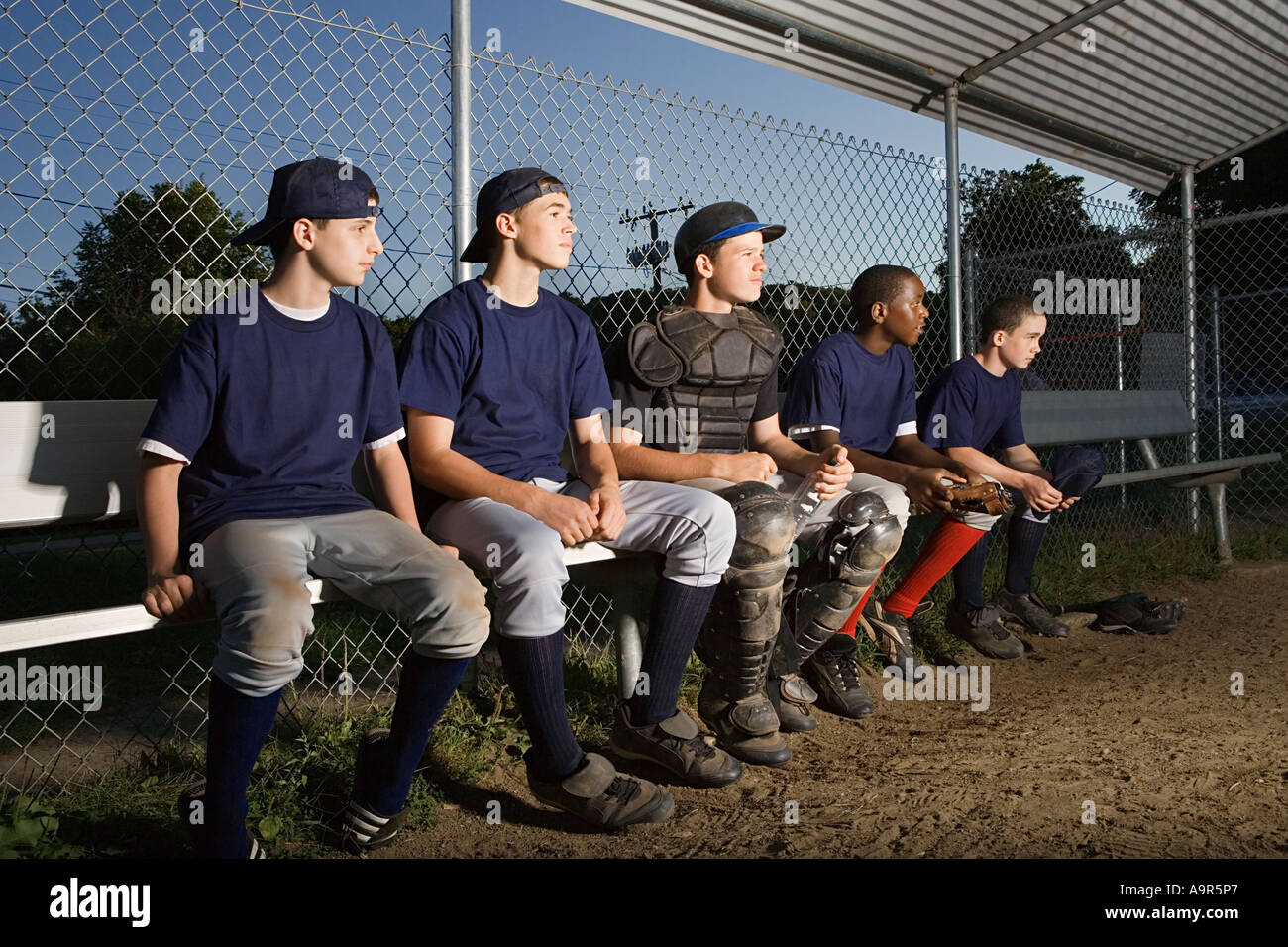 Five teenagers watching from the sidelines Stock Photo - Alamy