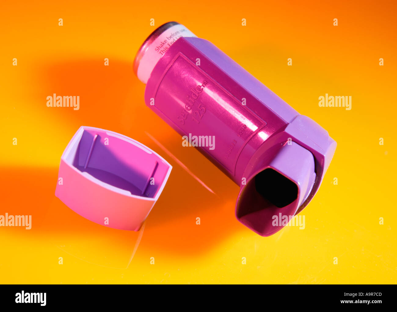 ASTHMA INHALER ON YELLOW BACKGROUND Stock Photo Alamy