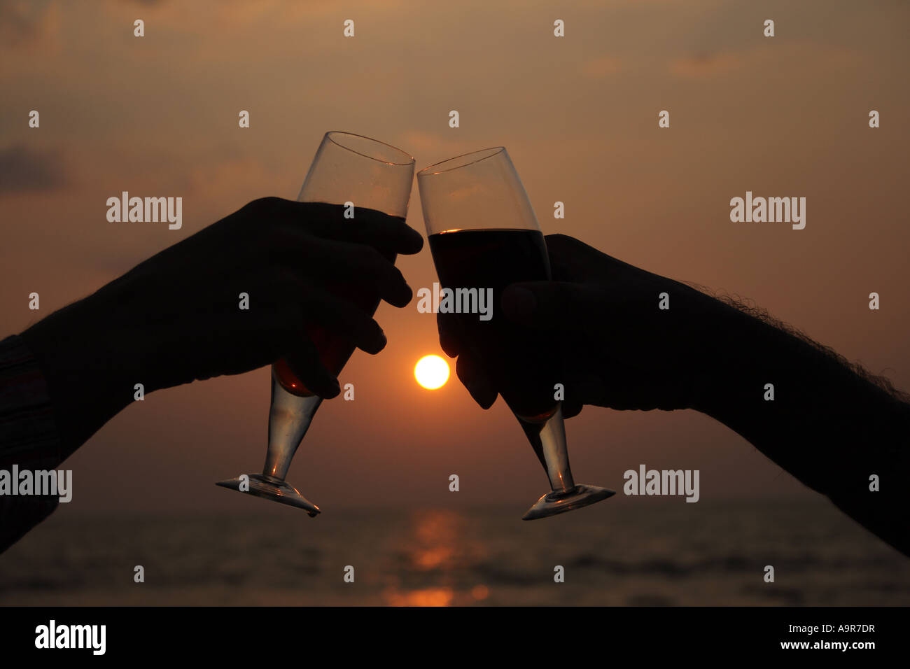 Silhouette couple drinking wine sunset hi-res stock photography and ...
