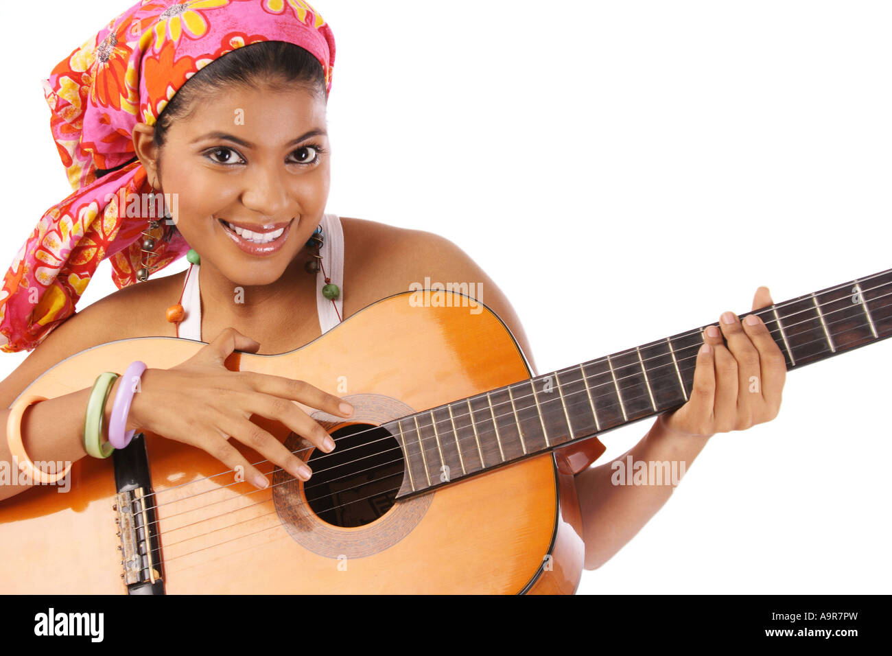 Portrait of a woman playing guitar Stock Photo - Alamy