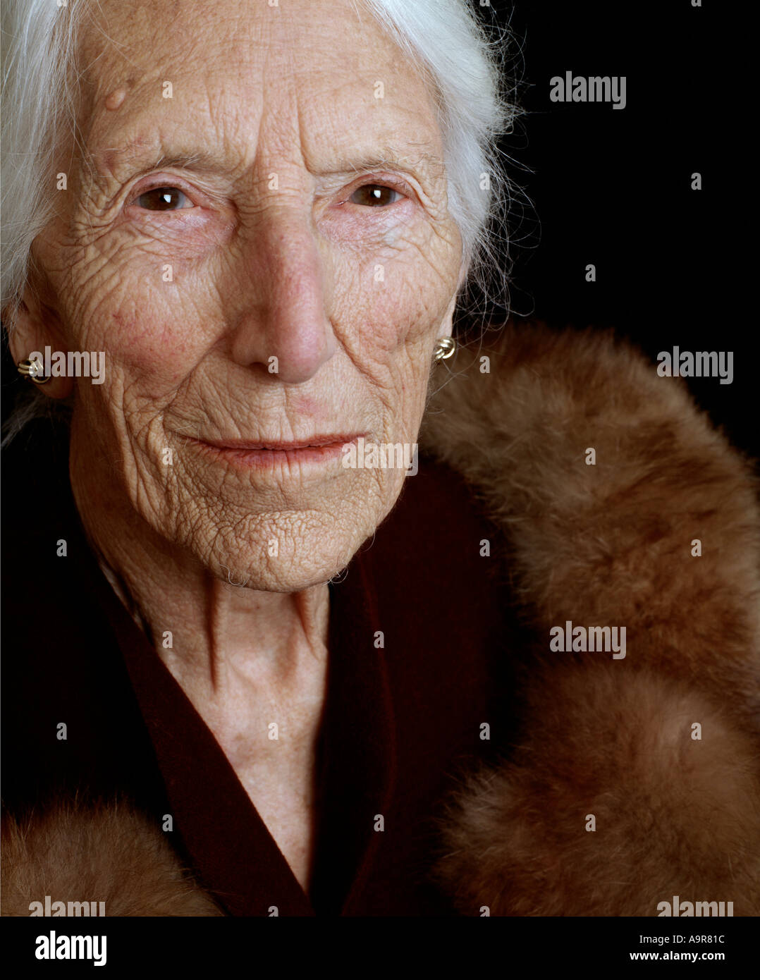 portrait of an old lady 80 to 100 year old wearing her war time wedding outfit proudly proud future past  Stock Photo