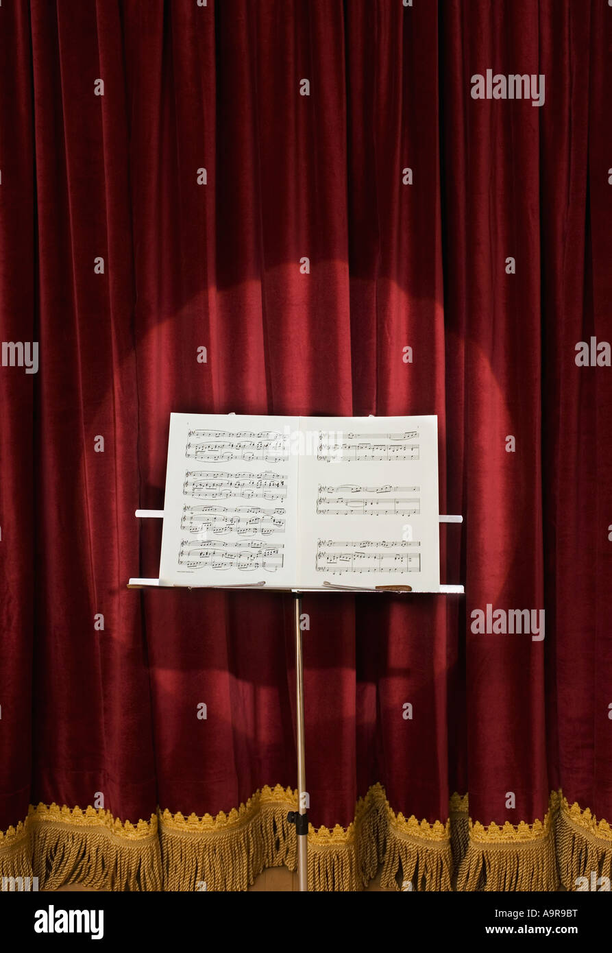 Spotlight on sheet music on stage Stock Photo