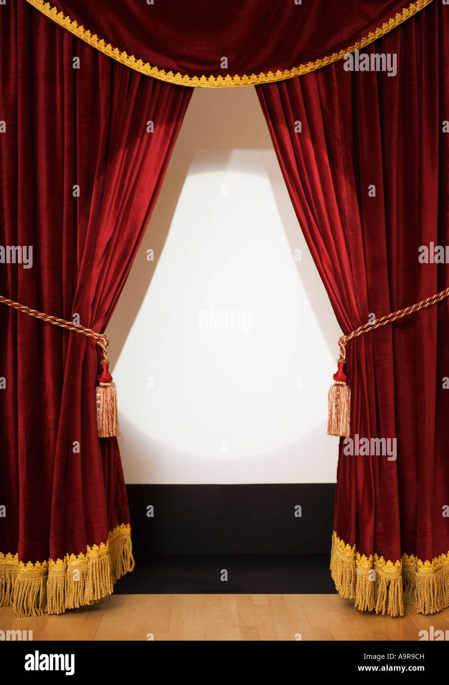 Screen behind open stage curtains Stock Photo