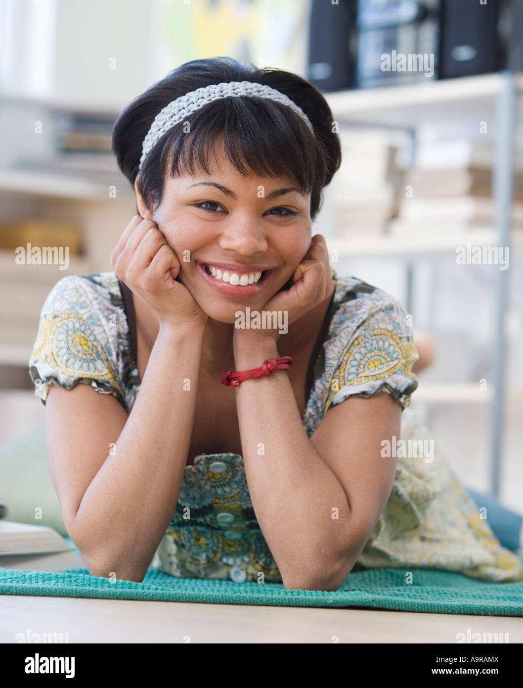 African woman laying on floor Stock Photo - Alamy