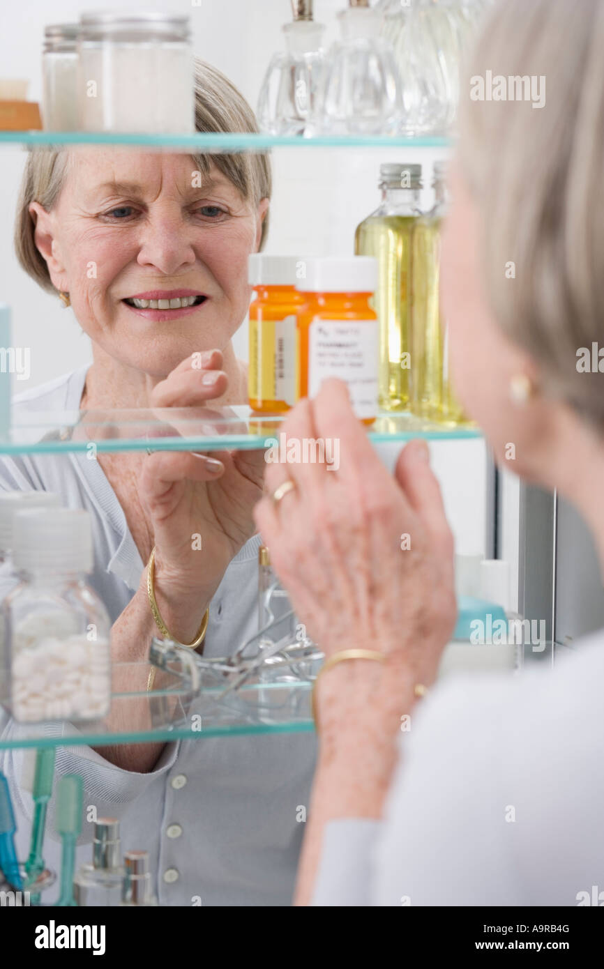 Senior woman looking in medicine Stock Photo Alamy