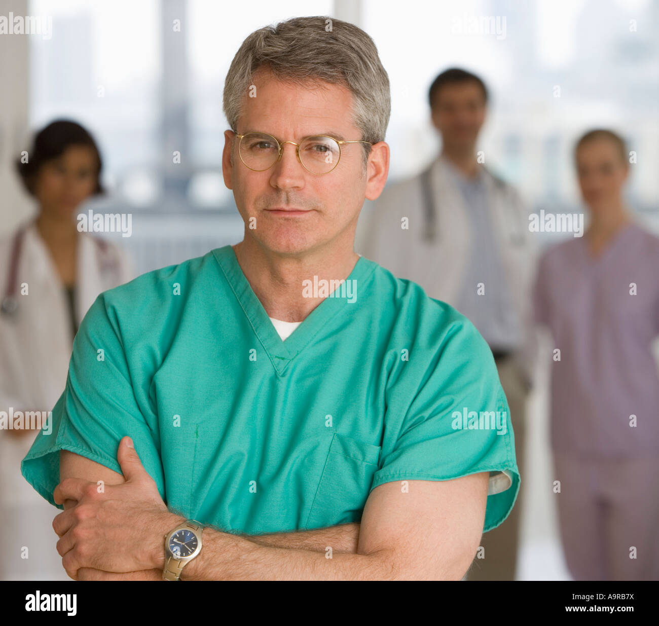 Male doctor wearing scrubs Stock Photo Alamy