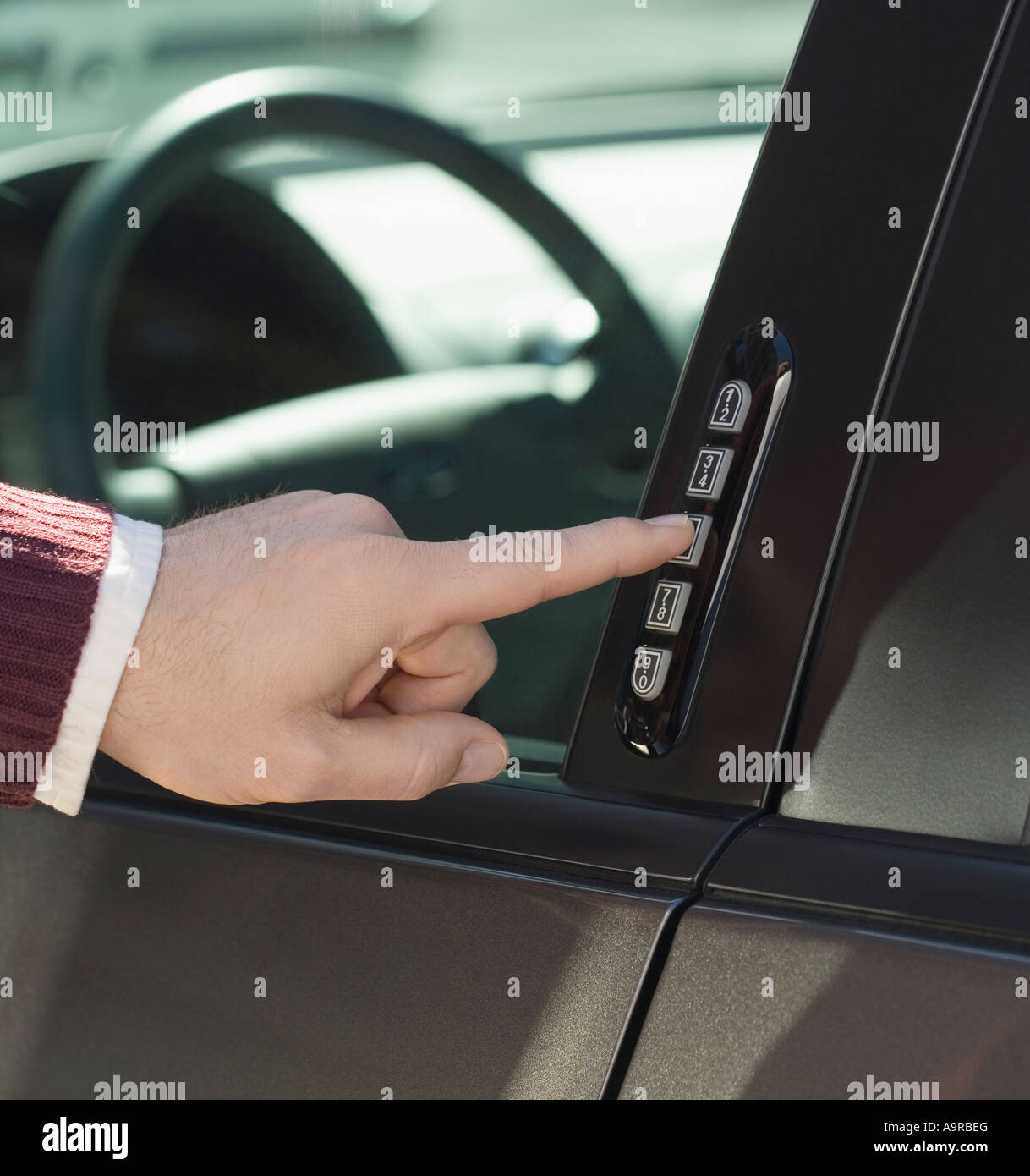 Man unlocking car door with keypad Stock Photo Alamy