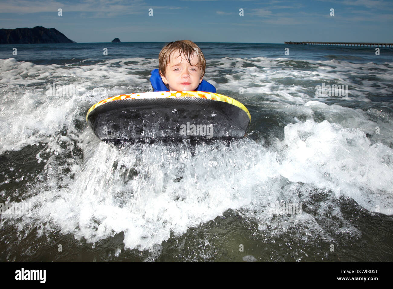 boy 6 zooming through the surf on body boogie board Stock Photo Alamy