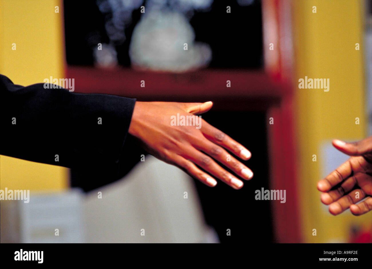 African male and female handshake Stock Photo - Alamy