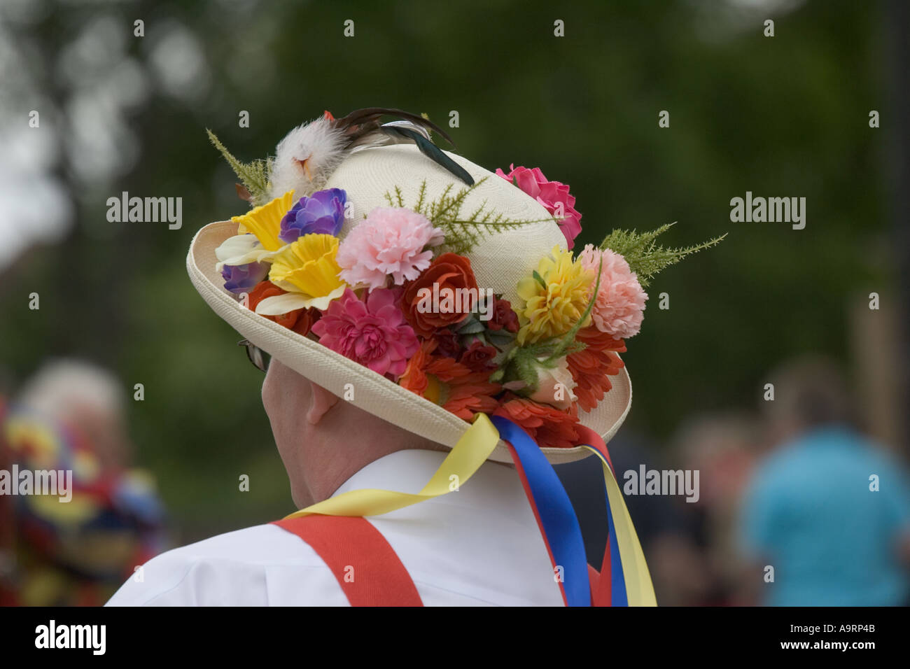Brightly coloured floral straw hat worn by Morris dancer Cleeve