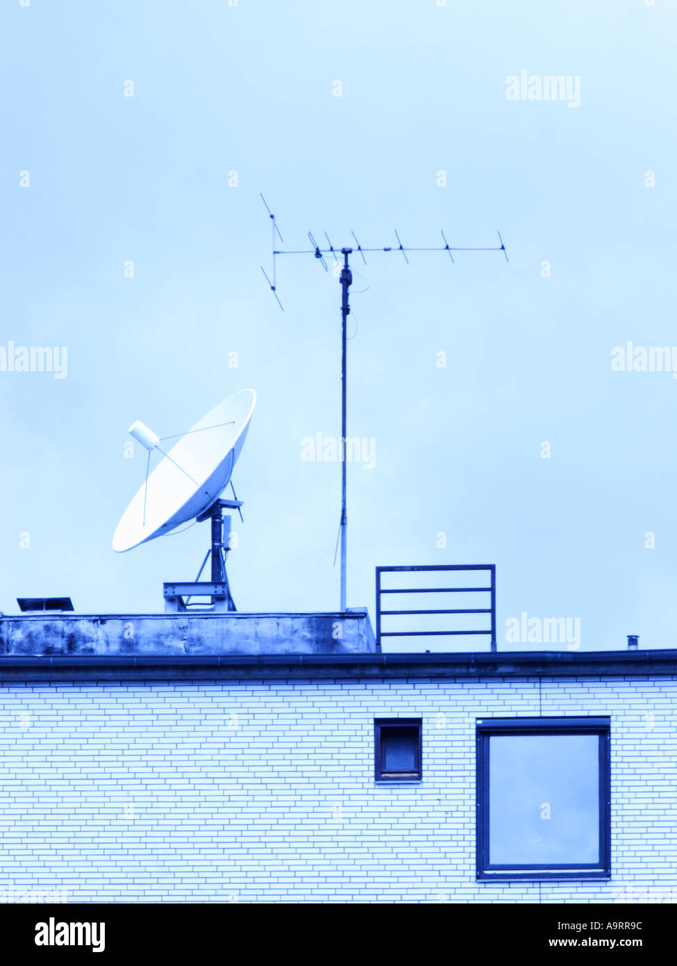 Satellite dish and television aerial on a roof Stock Photo Alamy