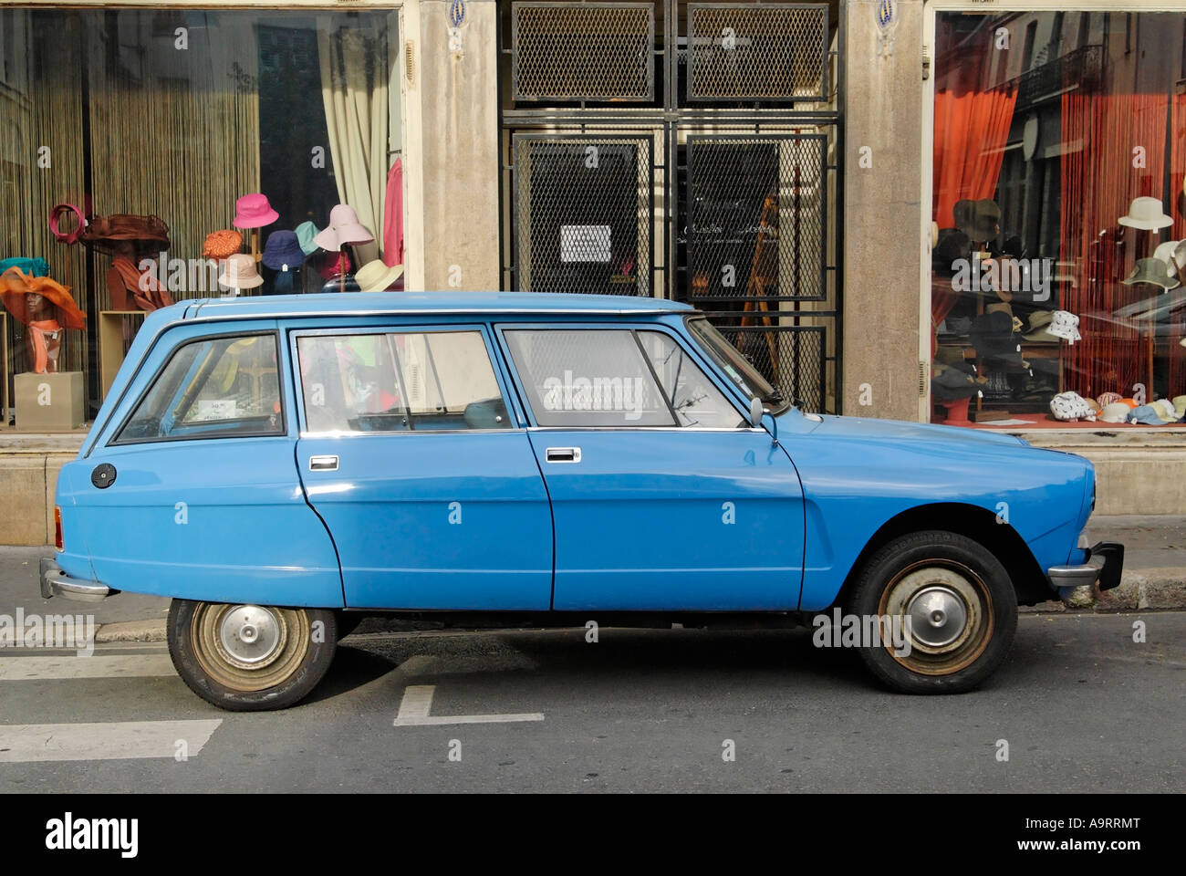 Blue Citroen parked outside old hat shop Tours France Europe Stock Photo