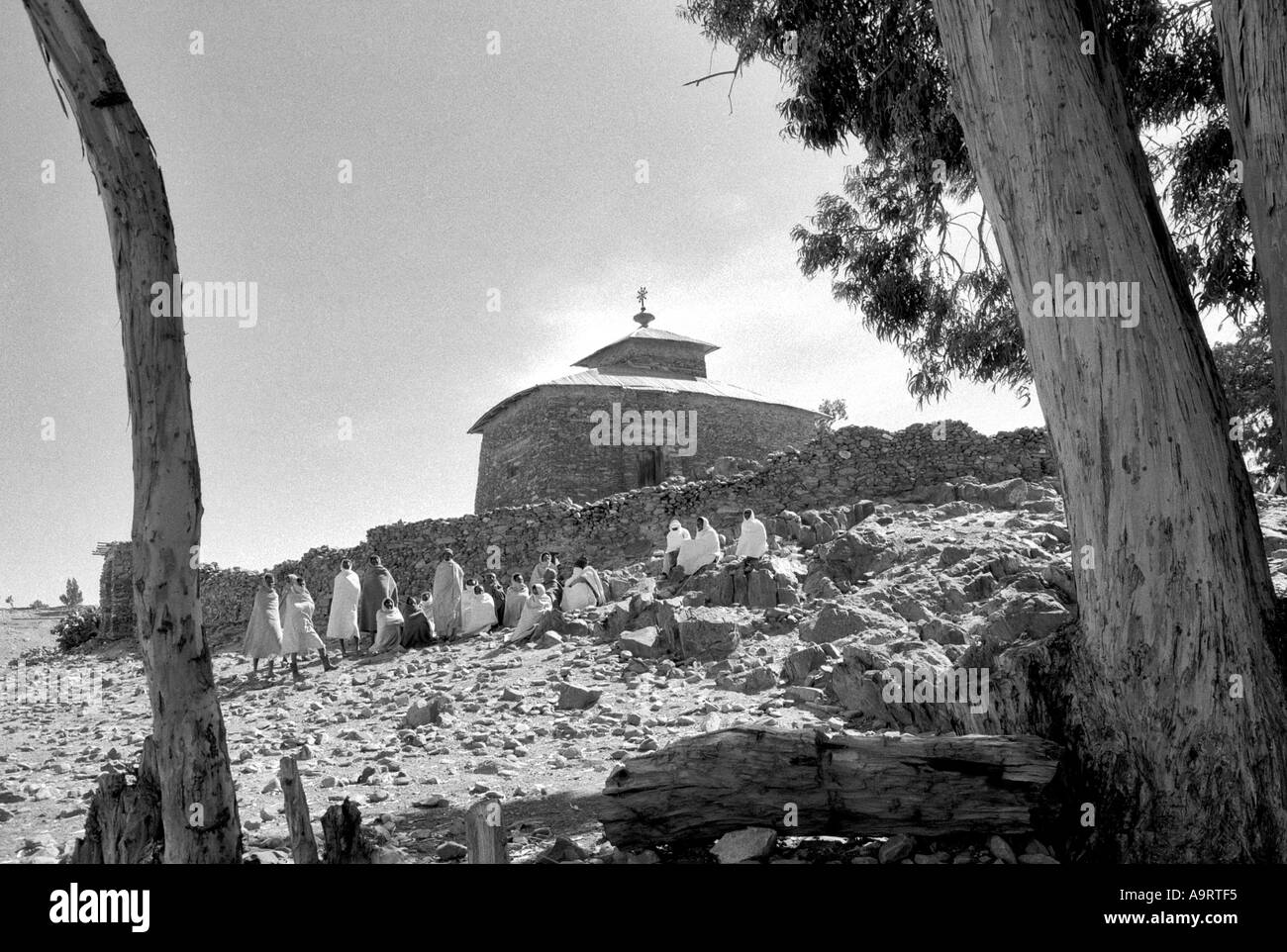 B/W of men in traditional white shawls at a meeting outside an Orthodox Tewahedo church in the remote northern highlands near Wukro, Tigray, Ethiopia Stock Photo